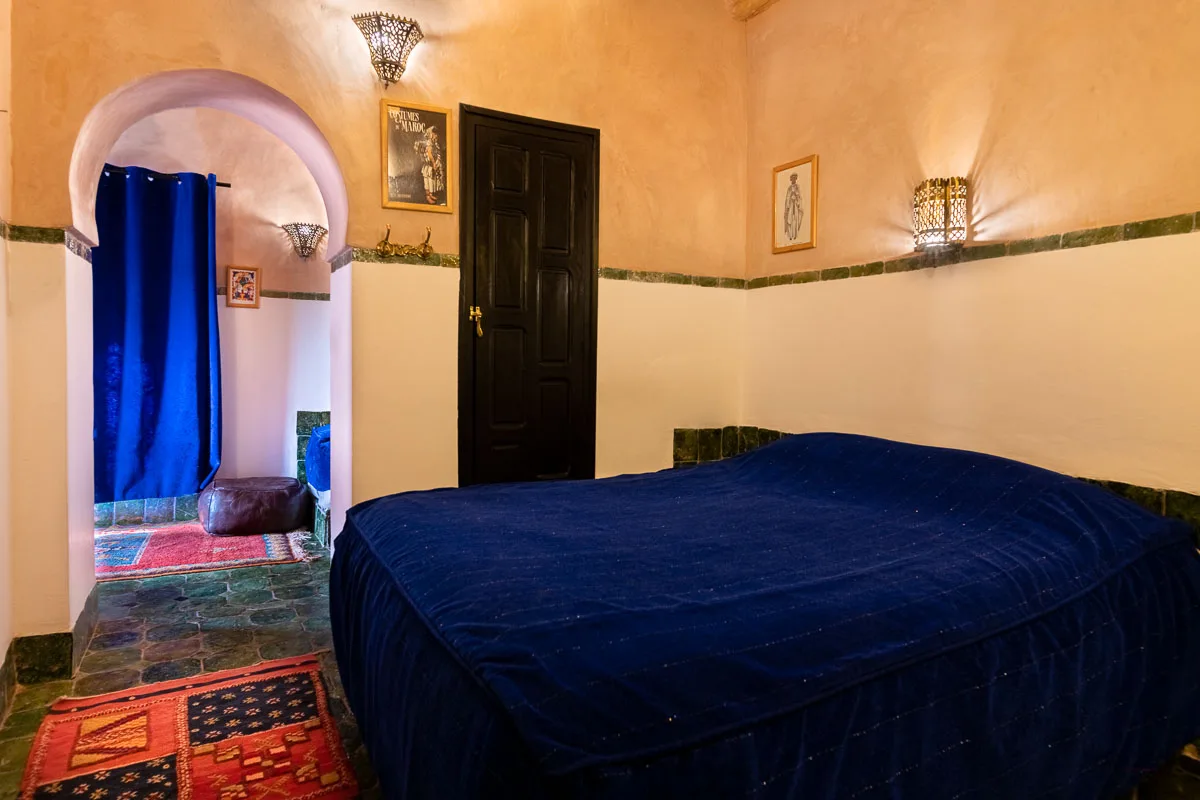 Blue and ochre guest room at Riad Dar Daif